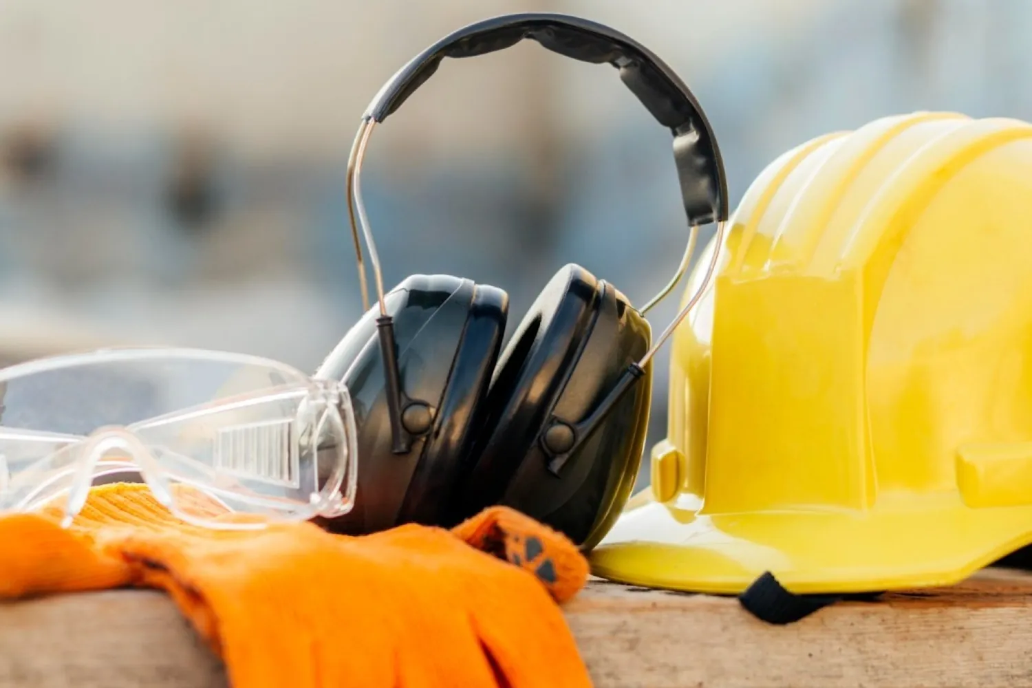 Construction safety equipment including hard hat, gloves, goggles and ear protection