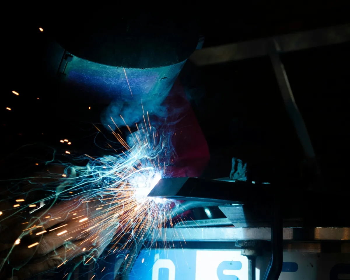 Industrial welding process with sparks during steel fabrication
